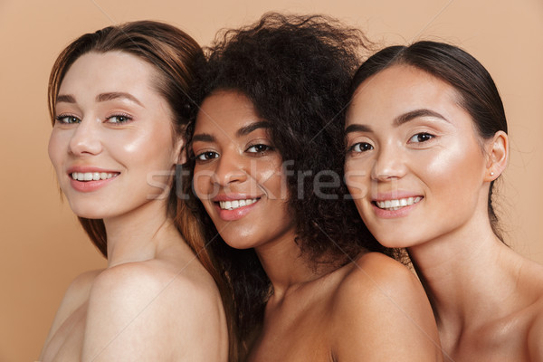 Close up image of Three Smiling naked woman posing together Stock photo © deandrobot