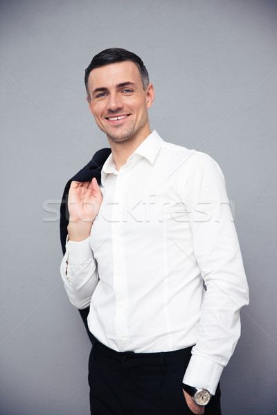 Souriant affaires veste épaule gris [[stock_photo]] © deandrobot