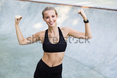Smiling fitness woman making selfie photo Stock photo © deandrobot