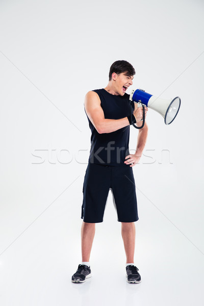 Fitness man shouting in loudspeaker Stock photo © deandrobot