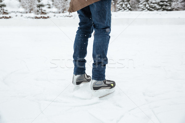 Male legs in ice skates Stock photo © deandrobot