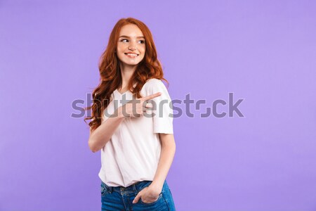 Menina longo cabelos cacheados sorridente olhando câmera Foto stock © deandrobot