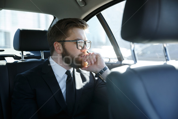 человека очки сидят назад сиденье автомобилей Сток-фото © deandrobot