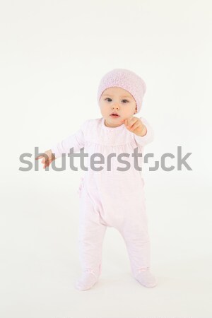 Cute little baby wearing hat standing on floor Stock photo © deandrobot