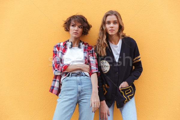 Stock photo: Two pretty teenage girls standing outdoors