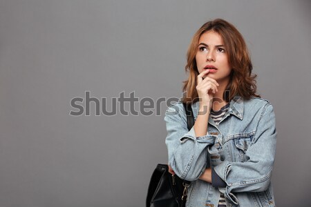 Close-up portrait of pretty brunette woman in casual wear showin Stock photo © deandrobot