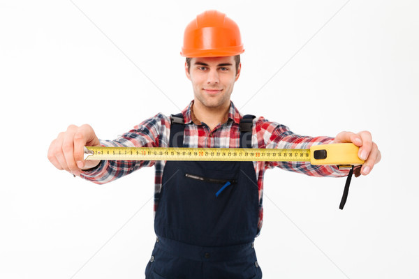 Portrait of a confident young male builder Stock photo © deandrobot