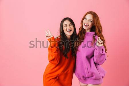 Retrato dois sorridente meninas colorido roupa Foto stock © deandrobot