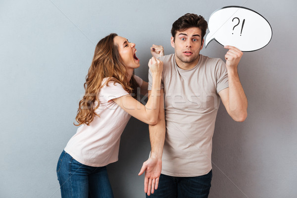 Portrait of a young mad couple having an argument Stock photo © deandrobot