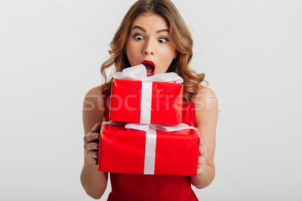 Portrait of an astonished young woman Stock photo © deandrobot