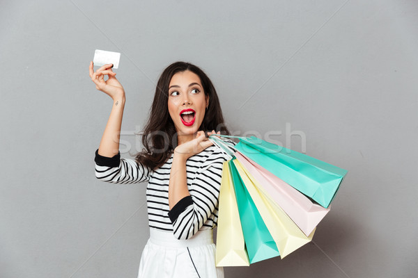 Portrait excité femme carte de crédit permanent [[stock_photo]] © deandrobot