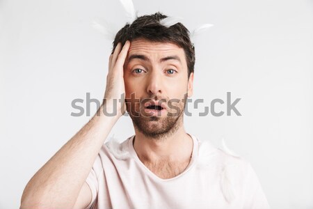Close up portrait of frowning angry bearded man Stock photo © deandrobot