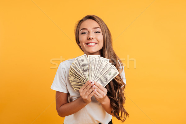 Portrait of a happy satisfied girl Stock photo © deandrobot