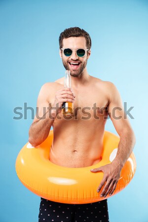 Porträt aufgeregt jungen shirtless Mann schwimmen Stock foto © deandrobot