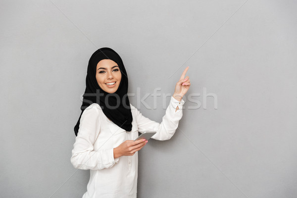 Portrait of gorgeous arab woman in headscarf with oriental makeu Stock photo © deandrobot