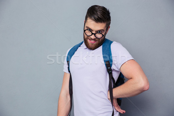 Portret mężczyzna nerd funny twarzy stałego szary Zdjęcia stock © deandrobot