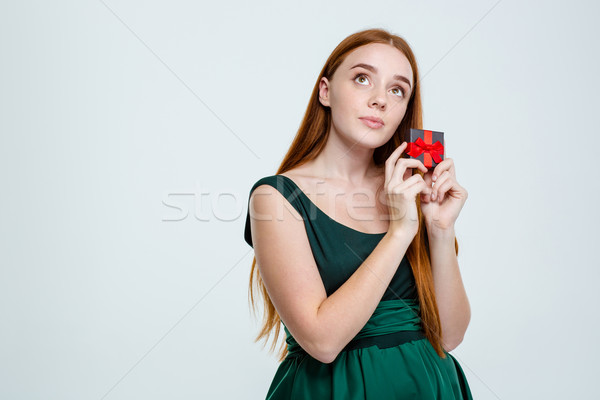 Woman holding jewelry box and dreaming Stock photo © deandrobot