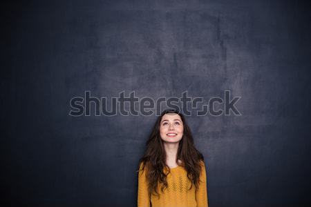 Sad woman standing with arms folded Stock photo © deandrobot