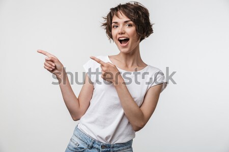 Happy attractive teenage girl in striped top showing ok sign  Stock photo © deandrobot