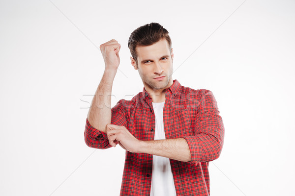Serious man with invisible Nunchuck Stock photo © deandrobot