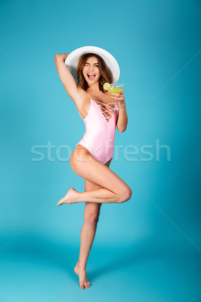 Full length portrait of a cheery girl Stock photo © deandrobot
