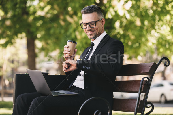 Portrait of a smiling businessman dressed in formal clothes Stock photo © deandrobot