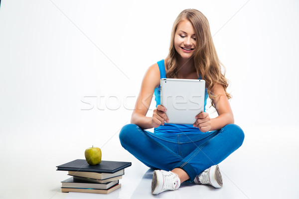 Girl sitting on the floor with tablet compute Stock photo © deandrobot