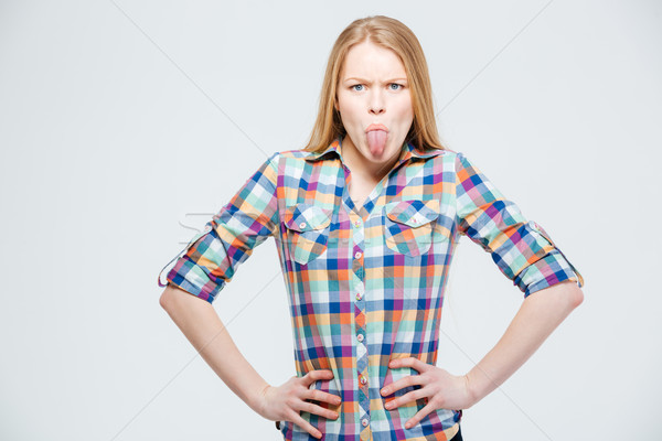 Jonge vrouw tonen tong geïsoleerd witte vrouw Stockfoto © deandrobot