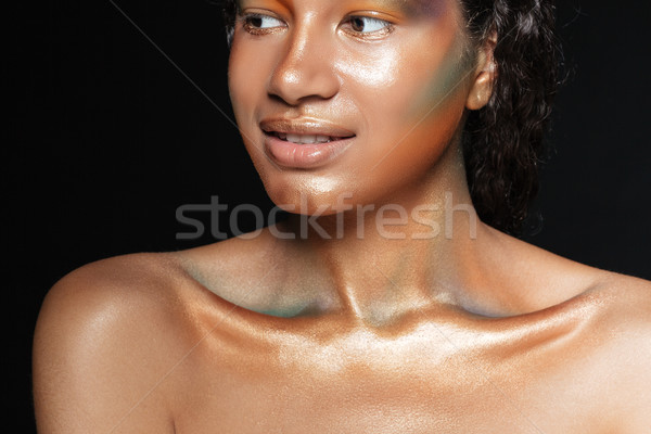 Beauty portrait of cute african young woman with shining makeup Stock photo © deandrobot