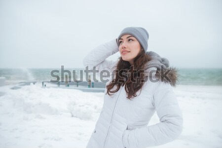 Pretty young lady wearing hat look aside. Stock photo © deandrobot