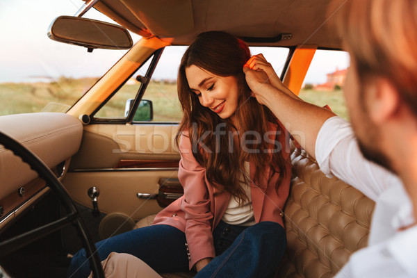 Fiatalember flörtöl barátnő megérint haj mosolyog Stock fotó © deandrobot