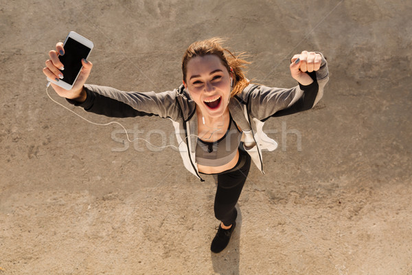 Topo ver feliz jovem esportes mulher Foto stock © deandrobot