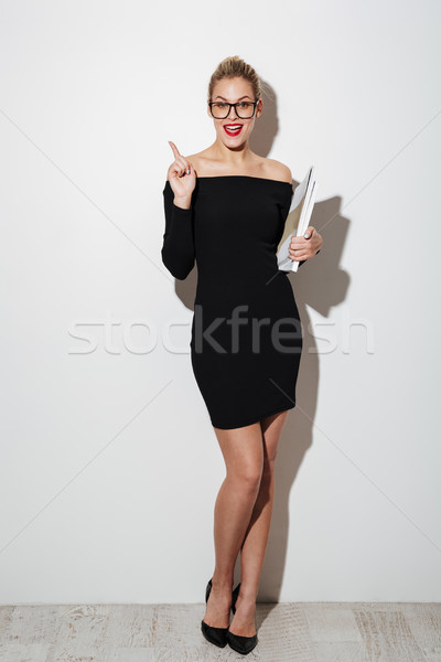 Image heureux femme robe lunettes [[stock_photo]] © deandrobot