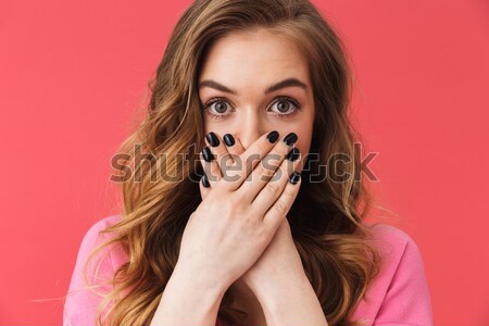 Portrait of a shocked brown haired woman Stock photo © deandrobot