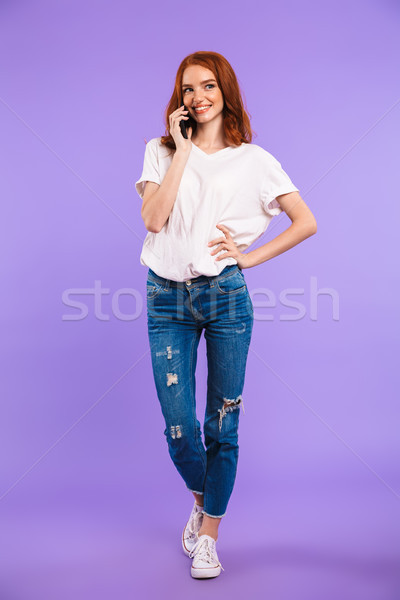 Teljes alakos portré mosolyog fiatal lány áll izolált Stock fotó © deandrobot