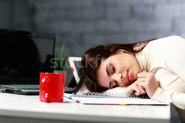 Young tired student fallen asleep at the table Stock photo © deandrobot