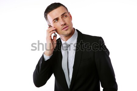 Confident businessman talking on the phone over white background Stock photo © deandrobot