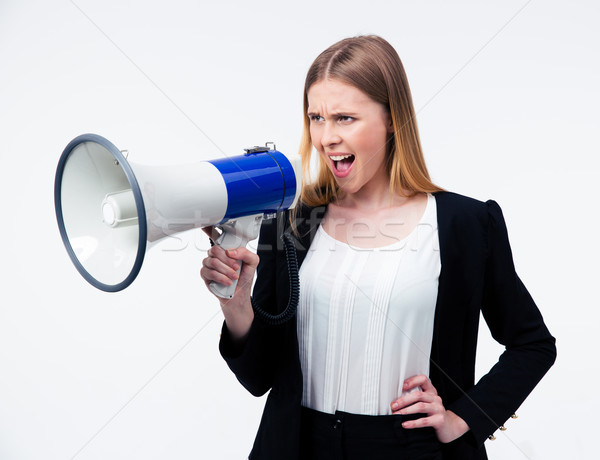 Young businesswoman shouting in megaphone Stock photo © deandrobot