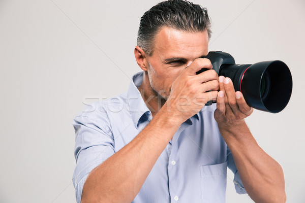 Portrait élégant photographe isolé blanche sourire [[stock_photo]] © deandrobot