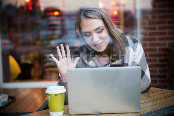 Happy girl making video call on laptop Stock photo © deandrobot