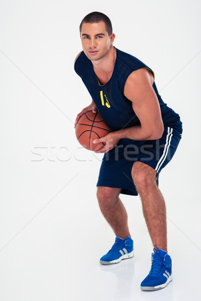 Full length portrait of a man playing in basketball  Stock photo © deandrobot