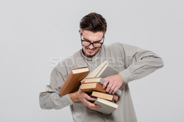 Unconfident student droping books Stock photo © deandrobot