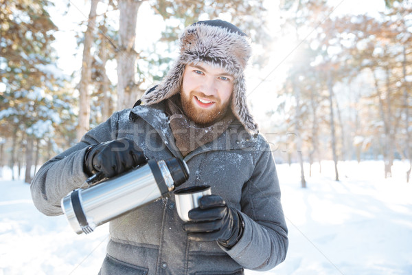 счастливым человека питьевой горячей чай зима Сток-фото © deandrobot