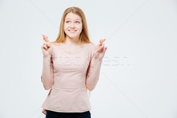 Woman with crossed fingers  Stock photo © deandrobot