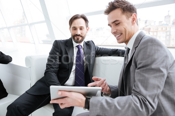 Two business partners talking in office Stock photo © deandrobot