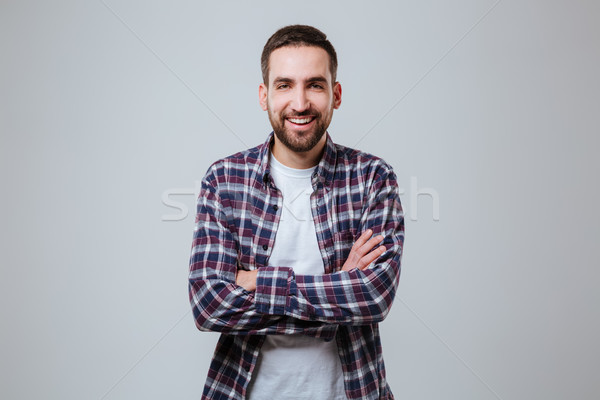 Man in shirt with crossed arms Stock photo © deandrobot