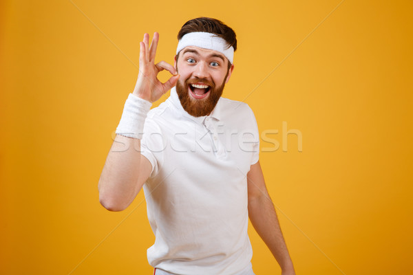 Happy sportsman showing ok sign Stock photo © deandrobot