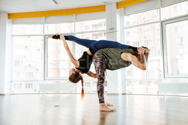 Duas mulheres equilíbrio ioga estúdio dois belo Foto stock © deandrobot