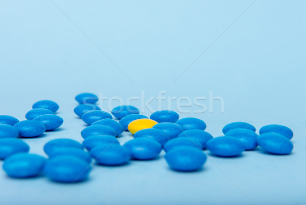 Colorful sweeties candy over blue table background. Stock photo © deandrobot
