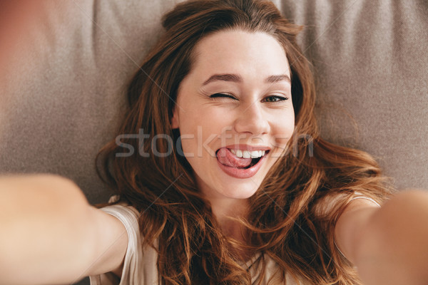 Picture Amazing happy emotional pretty lady make selfie. Stock photo © deandrobot